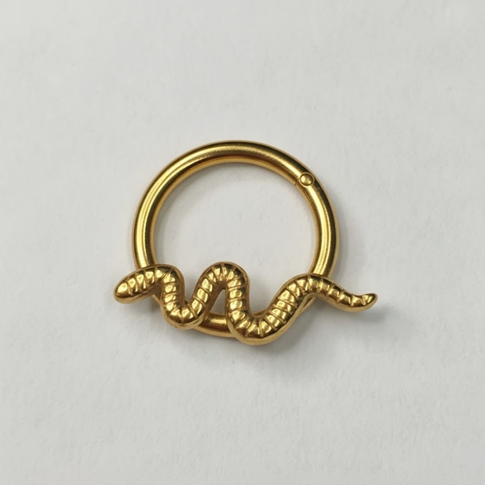 Clicker dorado con serpiente